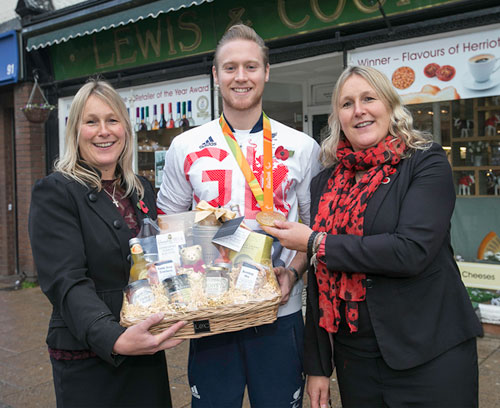 Laurence Whiteley collects a hamper from Victoria Howard & Bettina Bell